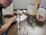 Steve Schiller developing calibration data on titration kits for Power Kleen parts washing detergent