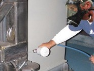 Jerry rust proofing Stingray parts washer cabinet before installation of insulation.